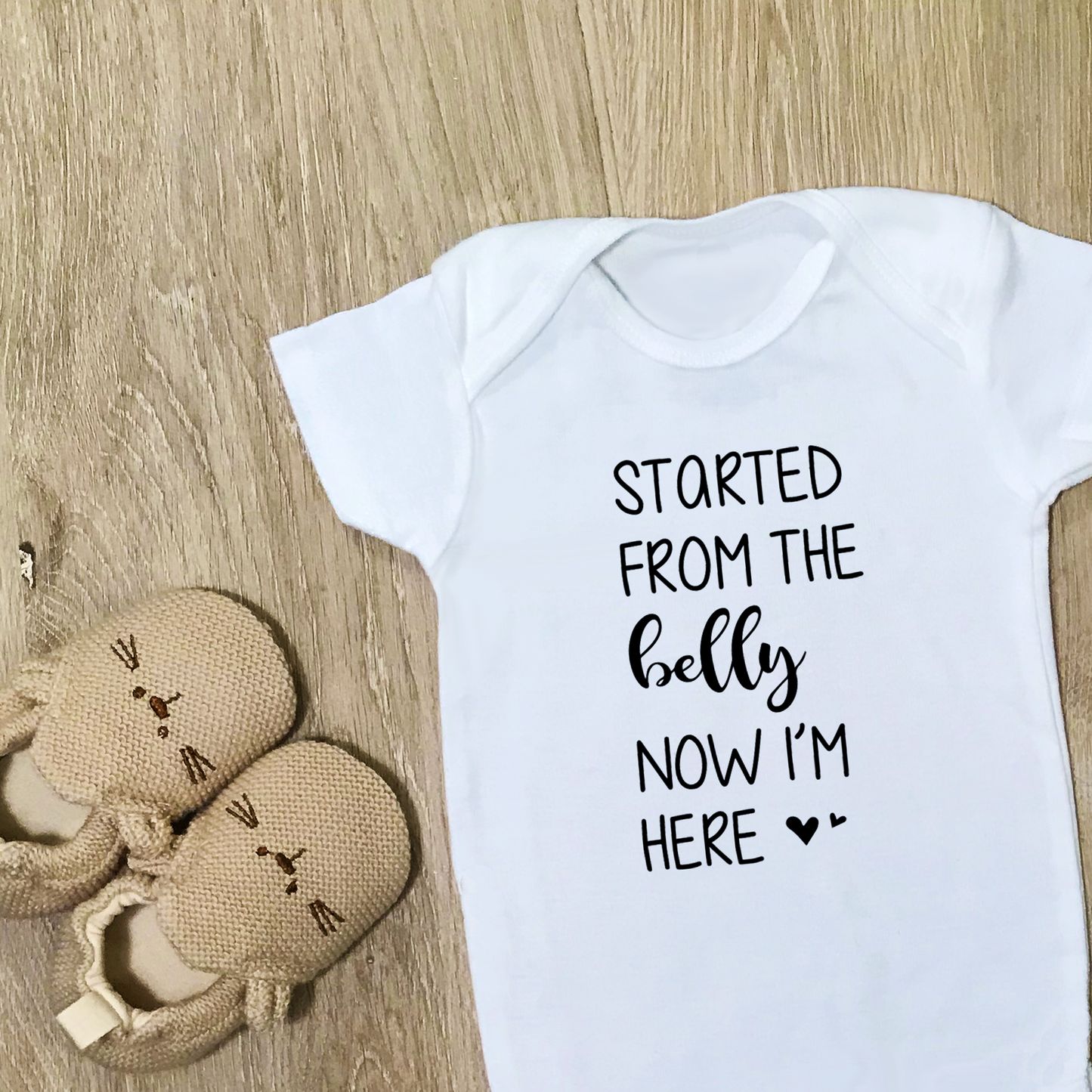 Started From The Belly Now I'm Here - Baby Bodysuit